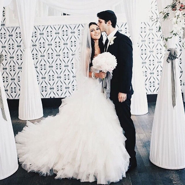 groom standing with bride wearing beautiful Winnie Couture wedding dress