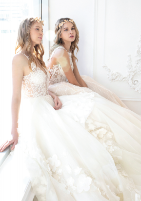 Two women in beautiful white wedding dresses